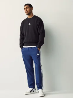 Joggingbroeken|adidas - Essentials 3-Strepen Stanford joggingbroek met open zoom Blauw