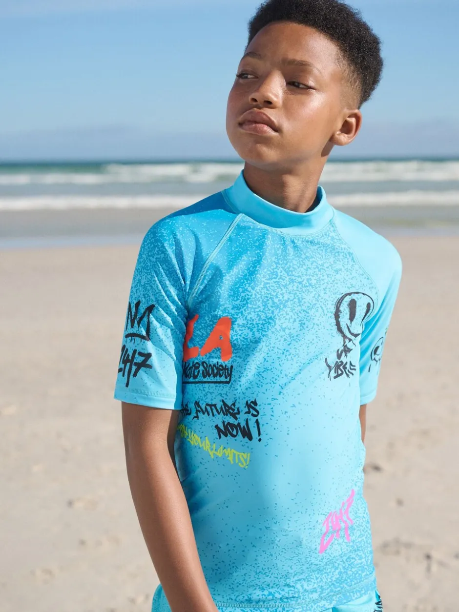 Badkleding*Next Blauw met graffitiprint - Surfhemdje (1,5 - 16 jr)