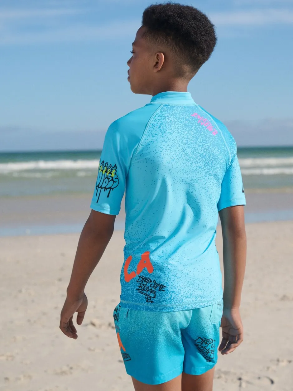 Badkleding*Next Blauw met graffitiprint - Surfhemdje (1,5 - 16 jr)