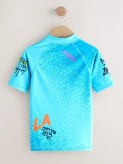 Badkleding*Next Blauw met graffitiprint - Surfhemdje (1,5 - 16 jr)