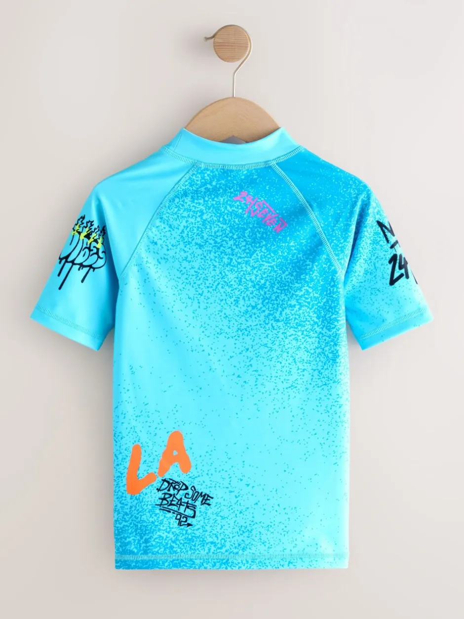 Badkleding*Next Blauw met graffitiprint - Surfhemdje (1,5 - 16 jr)