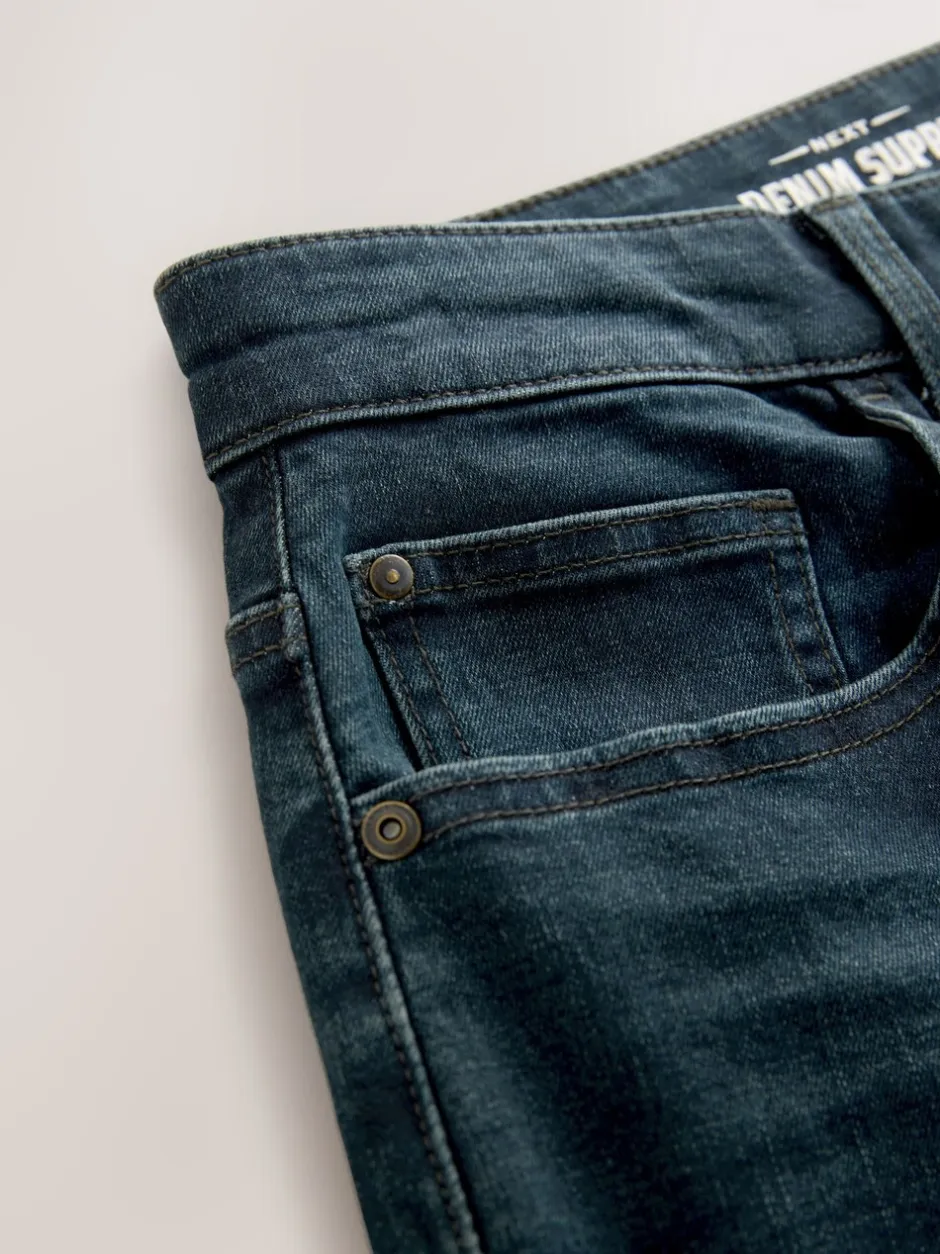 Jeans|Next Donkerblauwe wassing - Klassieke stretchjeans met standaard taps toelopende pasvorm