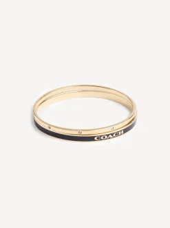 Sieraden|Coach - goudkleurige Signature Duo Bangle set in doosje Goudkleurig/zwart