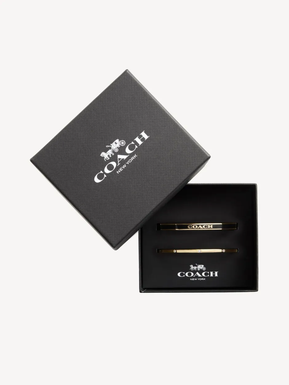 Sieraden|Coach - goudkleurige Signature Duo Bangle set in doosje Goudkleurig/zwart