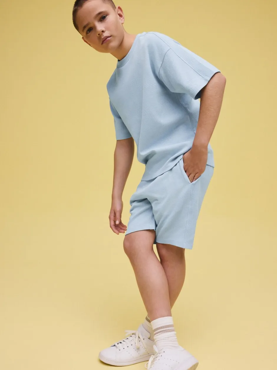 Shorts*Next - Set van T-shirt met textuur en korte mouwen en shorts (3 - 16 jr) Lichtblauw