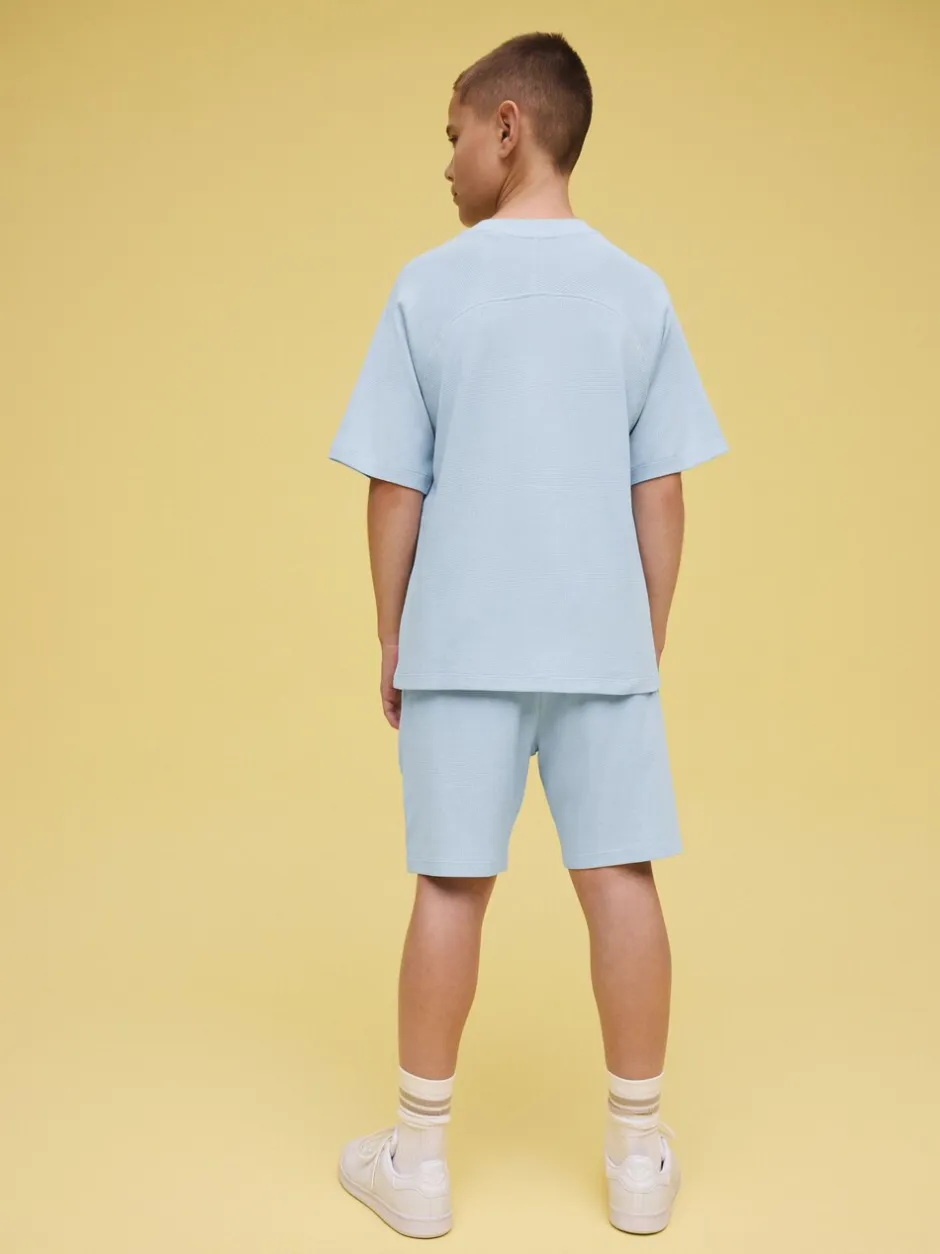 Shorts*Next - Set van T-shirt met textuur en korte mouwen en shorts (3 - 16 jr) Lichtblauw