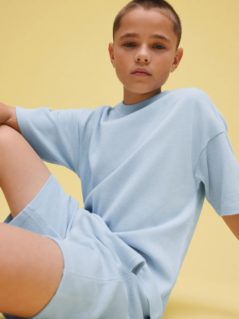 Shorts*Next - Set van T-shirt met textuur en korte mouwen en shorts (3 - 16 jr) Lichtblauw