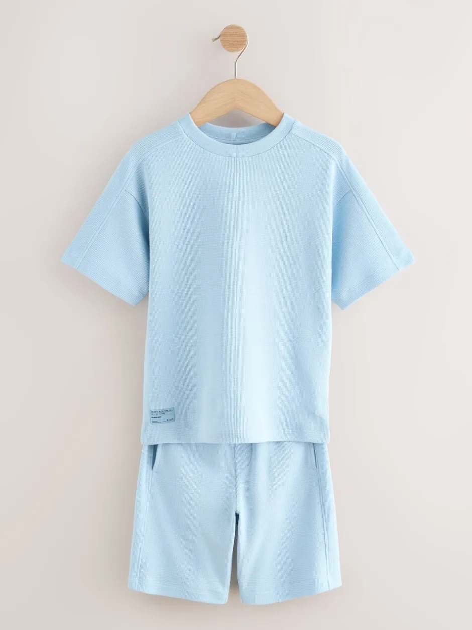 Shorts*Next - Set van T-shirt met textuur en korte mouwen en shorts (3 - 16 jr) Lichtblauw