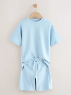 Shorts*Next - Set van T-shirt met textuur en korte mouwen en shorts (3 - 16 jr) Lichtblauw
