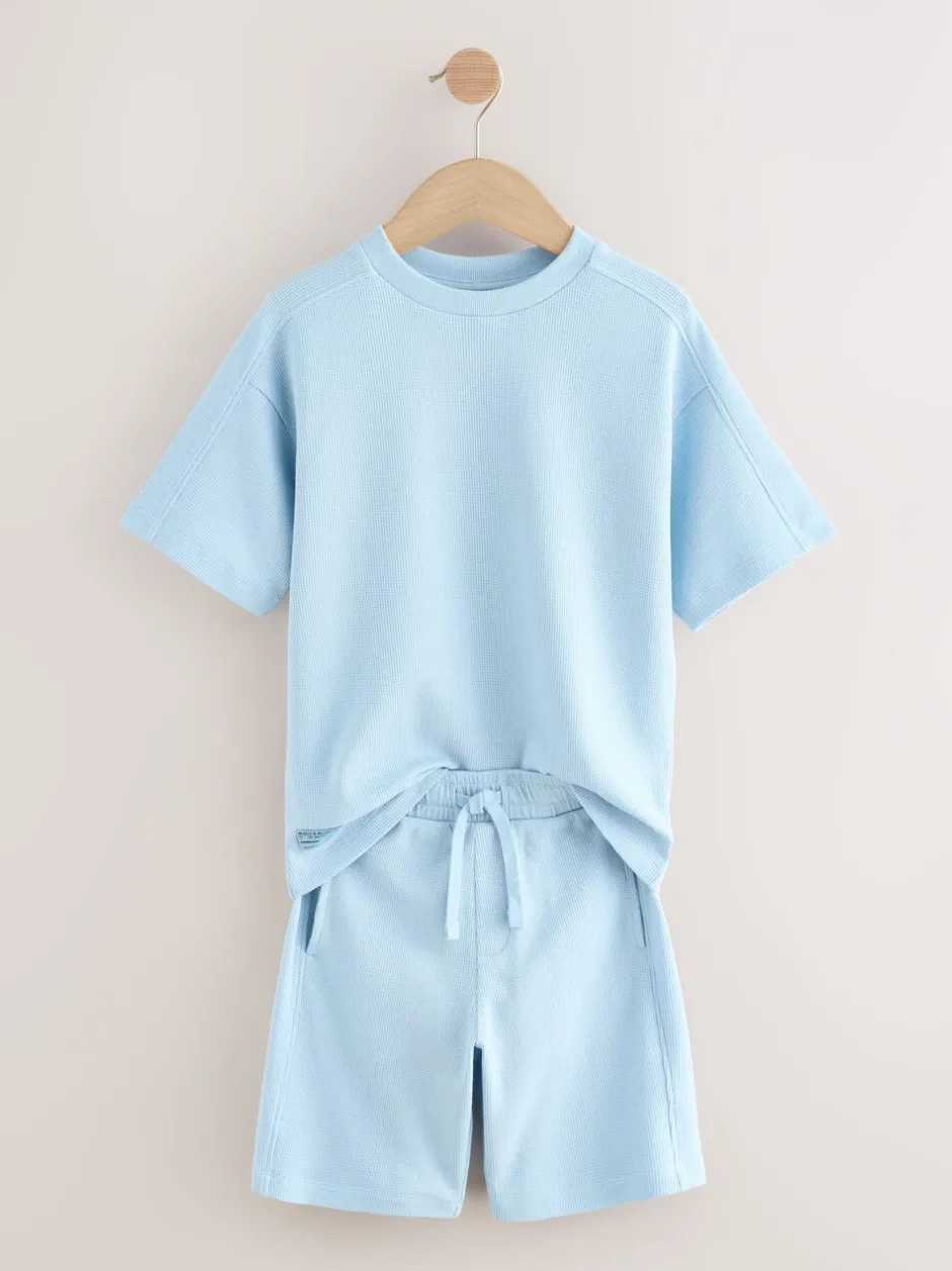 Shorts*Next - Set van T-shirt met textuur en korte mouwen en shorts (3 - 16 jr) Lichtblauw