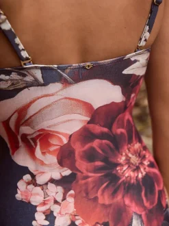 Badkleding*Next Marineblauw met bloemenprint - Vormgevend bandeaubadpak met buikcorrectie