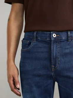 Jeans|Next Mediumblauw - Klassieke stretchjeans met standaard taps toelopende pasvorm