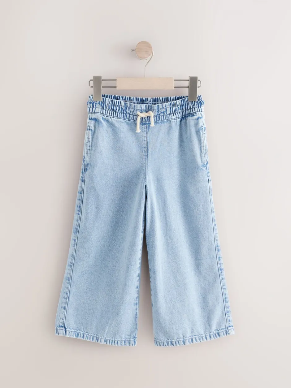 Jeans|Next - Jeans met elastische taille en wijde pijpen (3-16jr) Middenblauw denim