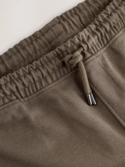 Joggingbroeken*Next - Joggingbroek van keperstof met rechte pijpen en textuur Naturel bruin