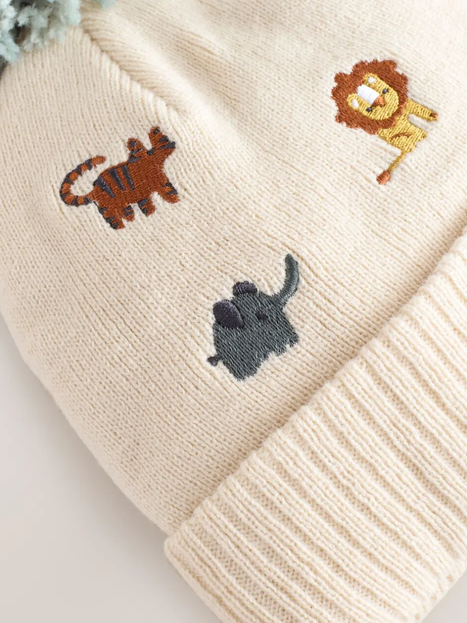 Mutsjes En Antikrabwantjes|Mutsen, Handschoenen En Sjaals|Next Naturel geborduurd met safariprint - Beanie-muts met pompon (3mnd-10jr)
