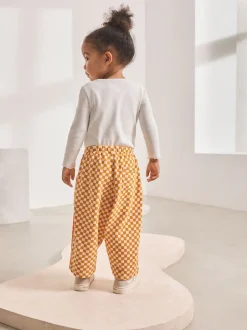 Broeken En Leggings*Next Oranje met dambordmotief - Broek met wijde kortere pijpen (3mnd -7jr)