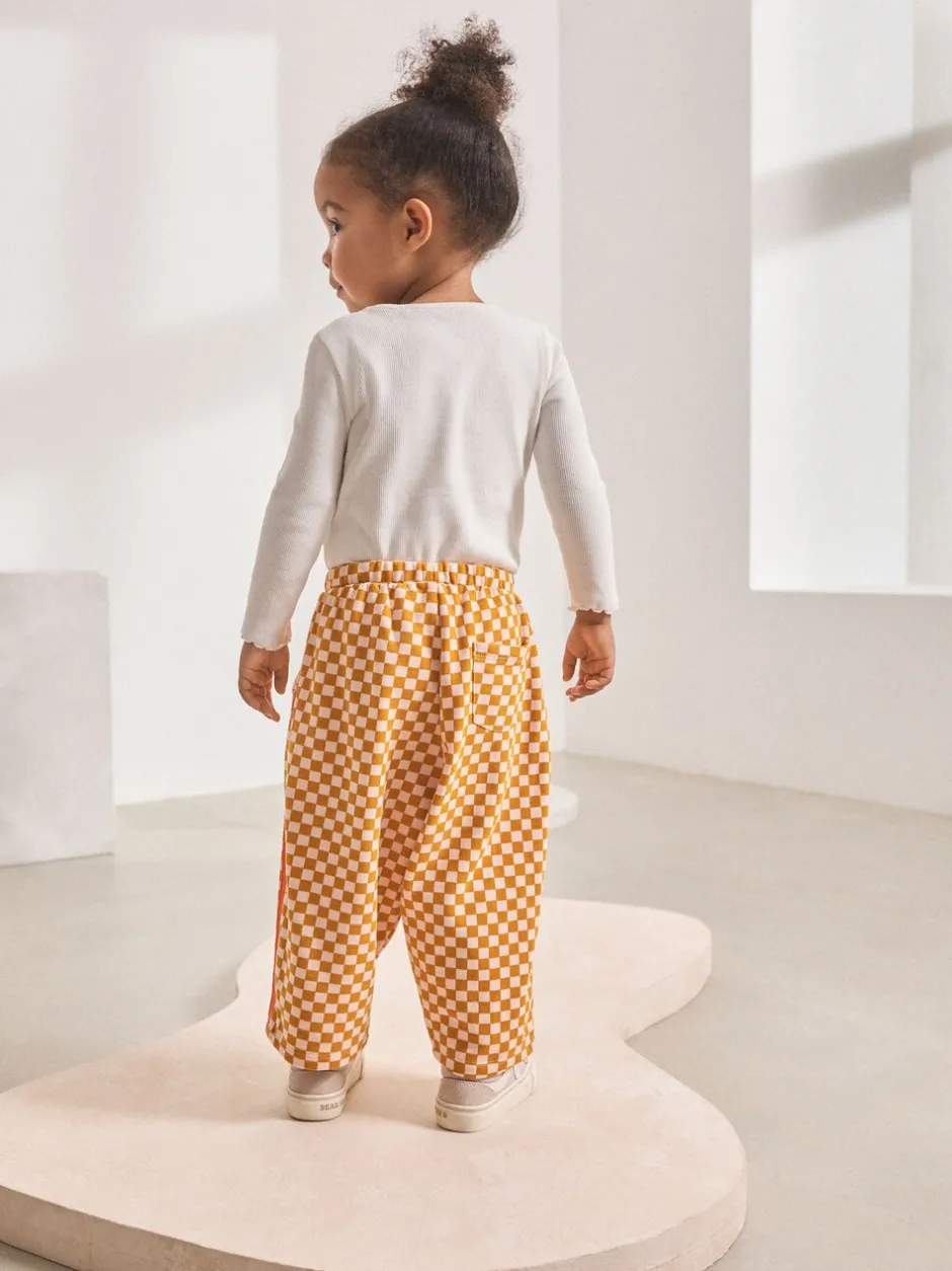 Broeken En Leggings*Next Oranje met dambordmotief - Broek met wijde kortere pijpen (3mnd -7jr)