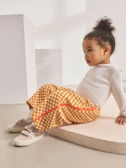 Broeken En Leggings*Next Oranje met dambordmotief - Broek met wijde kortere pijpen (3mnd -7jr)