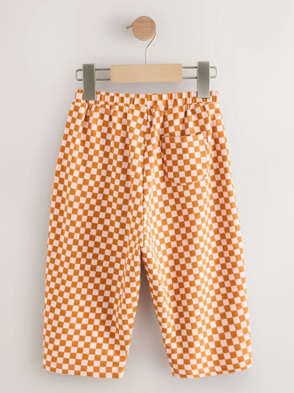 Broeken En Leggings*Next Oranje met dambordmotief - Broek met wijde kortere pijpen (3mnd -7jr)