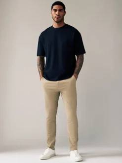 Broeken En Chino's|Next Pastelgeel - Strakke Pasvorm - Stretchy chino