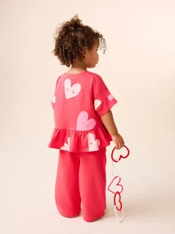 Tops|T-Shirts|Next Rood met hartjesprint - T-shirt met peplum en korte mouwen (3mnd -7jr)