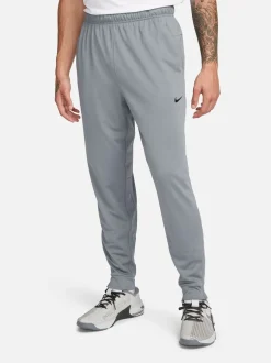 Joggingbroeken|Nike - Dri-FIT Totality trainingsbroek met taps toelopende pijpen Rookgrijs