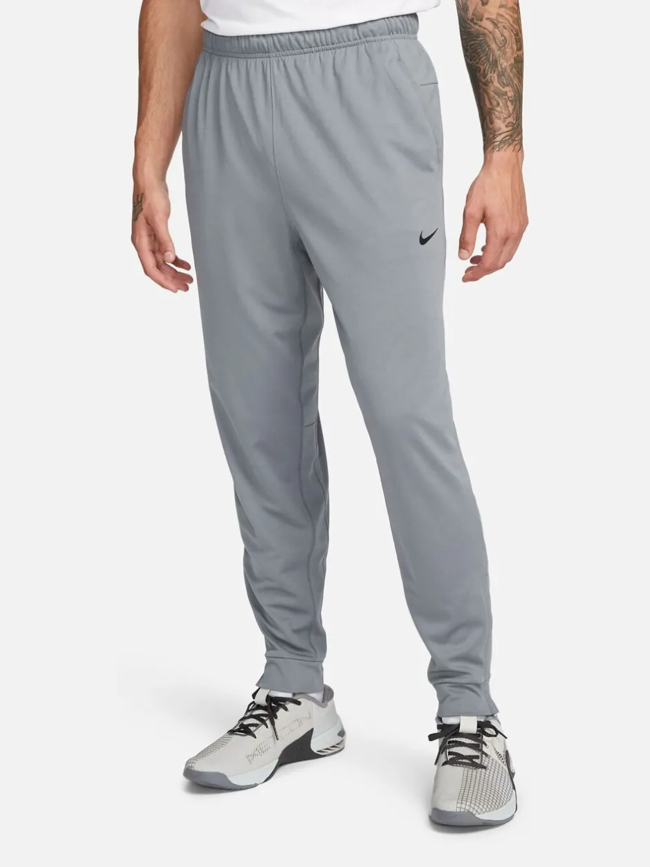 Joggingbroeken|Nike - Dri-FIT Totality trainingsbroek met taps toelopende pijpen Rookgrijs