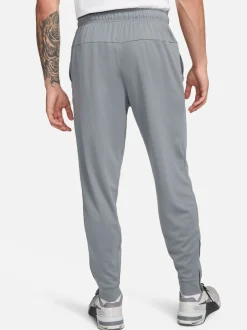 Joggingbroeken|Nike - Dri-FIT Totality trainingsbroek met taps toelopende pijpen Rookgrijs