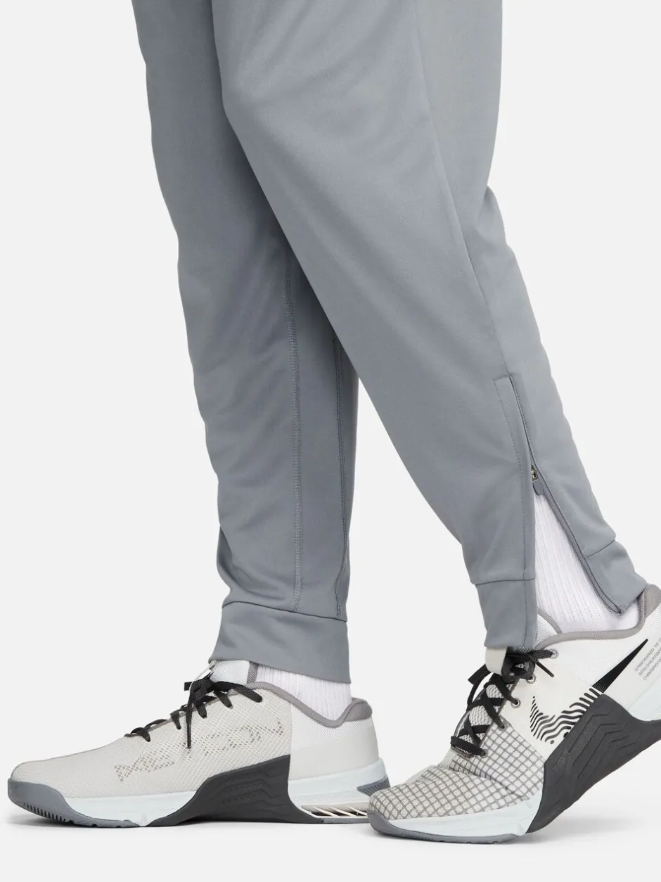 Joggingbroeken|Nike - Dri-FIT Totality trainingsbroek met taps toelopende pijpen Rookgrijs