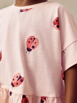 Tops|T-Shirts|Next Roze lieveheersbeestje - T-shirt met peplum en korte mouwen (3mnd -7jr)