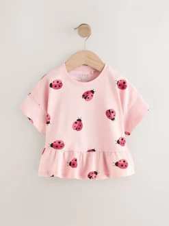 Tops|T-Shirts|Next Roze lieveheersbeestje - T-shirt met peplum en korte mouwen (3mnd -7jr)