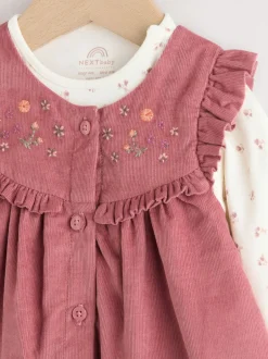Jurken|Jurken*Next Roze met borduursel - Set van corduroy pinafore, bodysuit met lange mouwen en maillot voor baby's (0mnd-2jr)