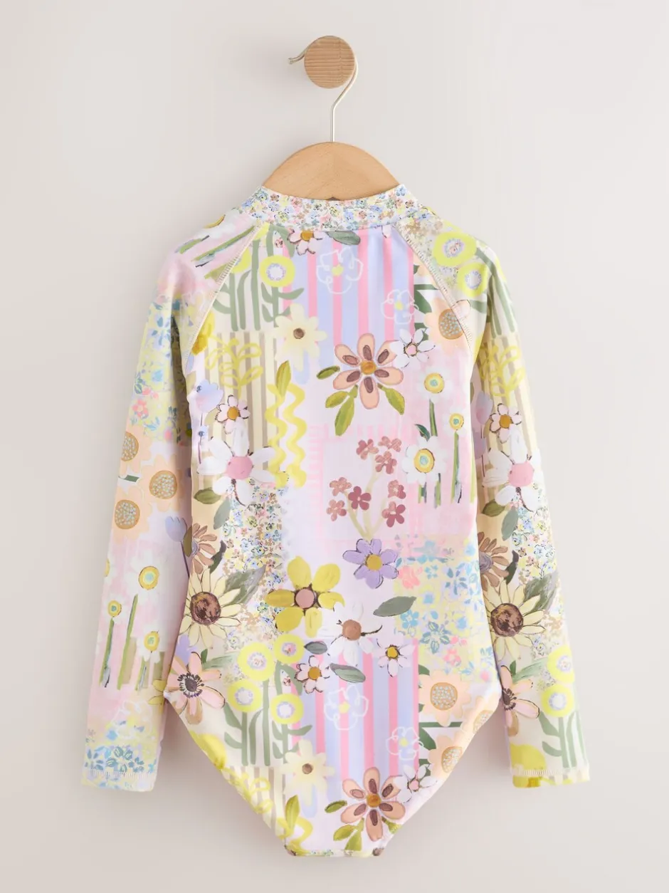Badkleding*Next Roze met gebloemde lapjesprint - Long Sleeve Sunsafe Swimsuit (3mths-16yrs)