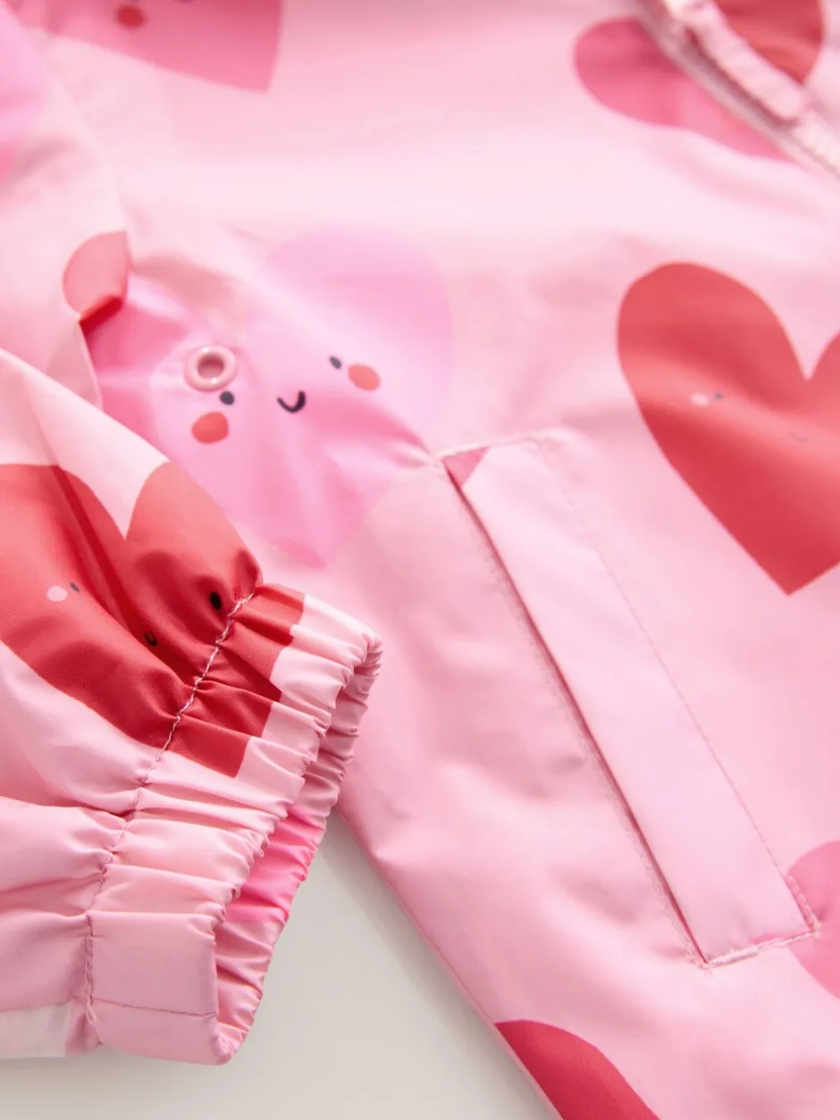 Jassen En Jacks*Next Roze met hartjesprint - Regenbestendig jack met print (3mnd-7jr)