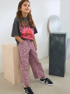 Jeans*Next - Jeans met wijde pijpen (3-16 jr) Roze met luipaardprint