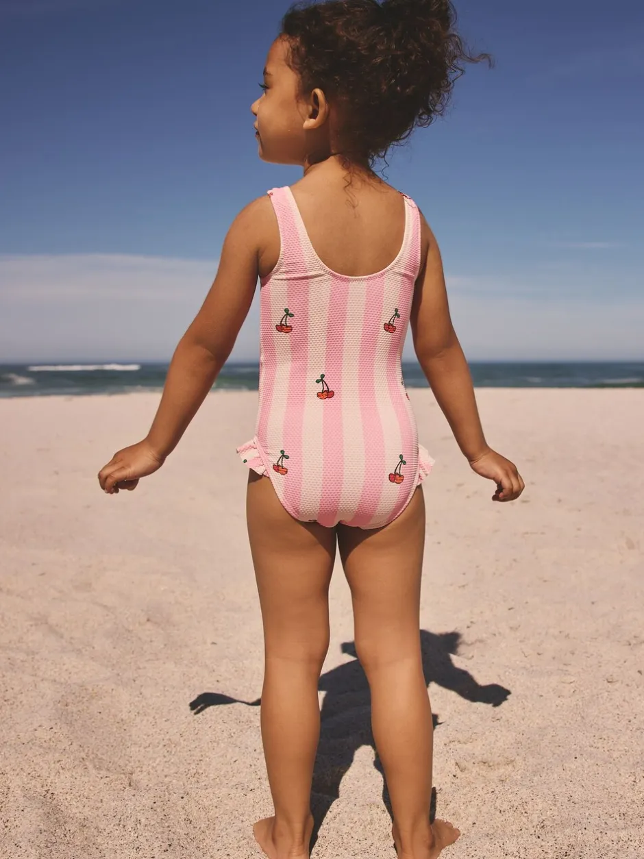 Badkleding|Badkleding|Next - Badpak met ruches op de pijpen (3mnd -7jr) Roze met streep- en kersenprint