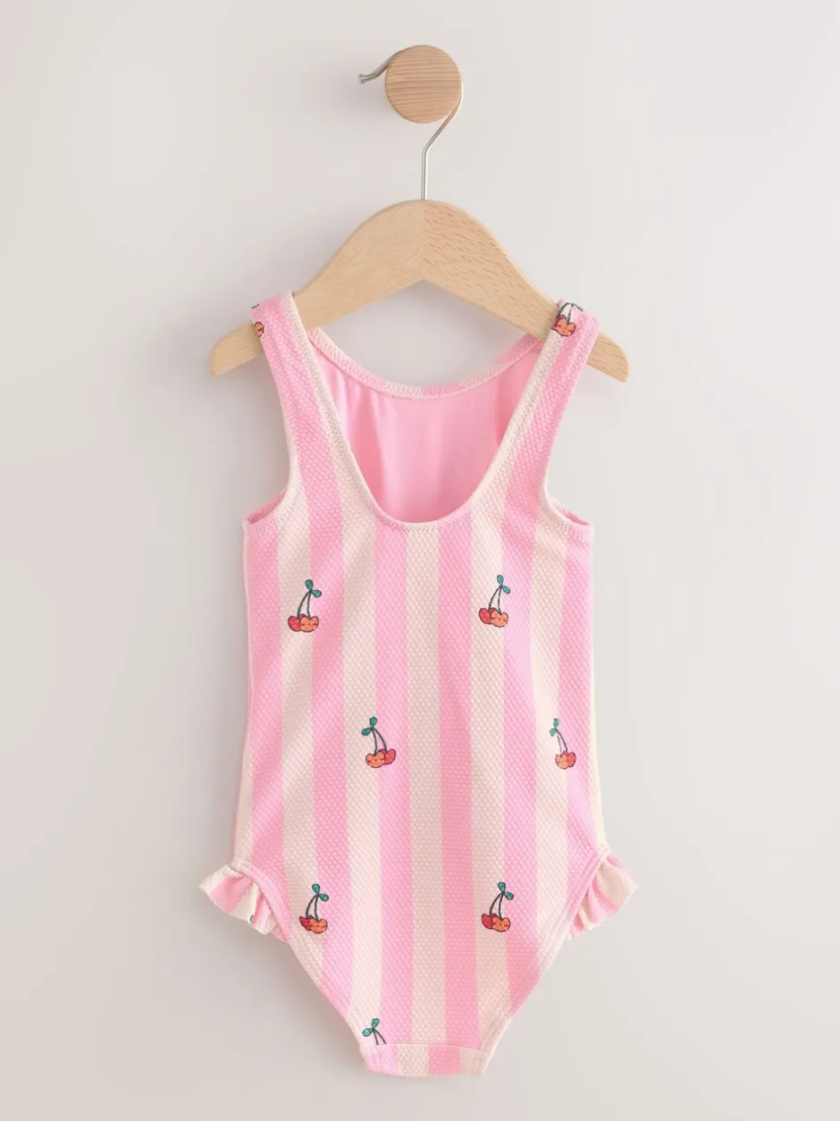 Badkleding|Badkleding|Next - Badpak met ruches op de pijpen (3mnd -7jr) Roze met streep- en kersenprint