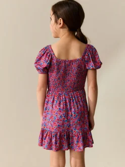 Jumpsuits En Playsuits*Next Roze met vrolijke print - Romper met smokwerk (3-16jr)