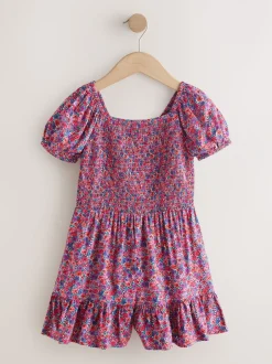 Jumpsuits En Playsuits*Next Roze met vrolijke print - Romper met smokwerk (3-16jr)