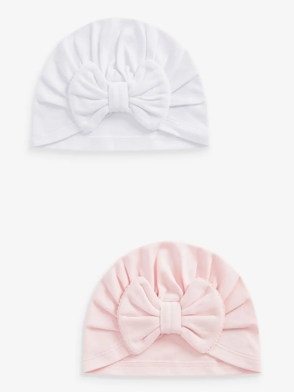 Mutsjes En Antikrabwantjes|Mutsen, Handschoenen En Sjaals|Next - Set van 2 babyturbanen (0-18mnd) Roze/wit grote strik