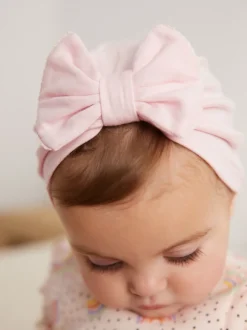 Mutsjes En Antikrabwantjes|Mutsen, Handschoenen En Sjaals|Next - Set van 2 babyturbanen (0-18mnd) Roze/wit grote strik