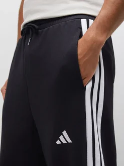 Joggingbroeken|adidas - Essentials Three Stripes Fleece Wide Leg Trousers Zwart