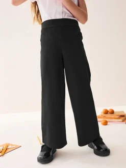 Schoolkleding|Next - Jersey broek met wijde pijpen, stretch en hoog katoengehalte (3-17jr) Zwart
