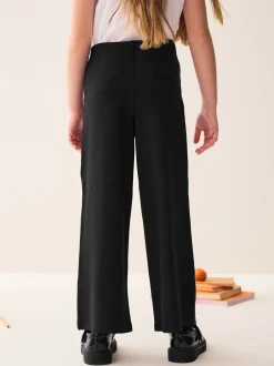 Schoolkleding|Next - Jersey broek met wijde pijpen, stretch en hoog katoengehalte (3-17jr) Zwart