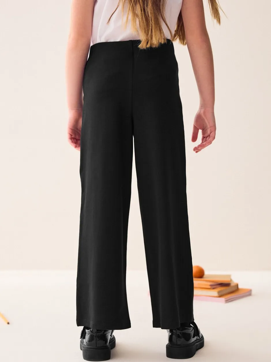 Schoolkleding|Next - Jersey broek met wijde pijpen, stretch en hoog katoengehalte (3-17jr) Zwart