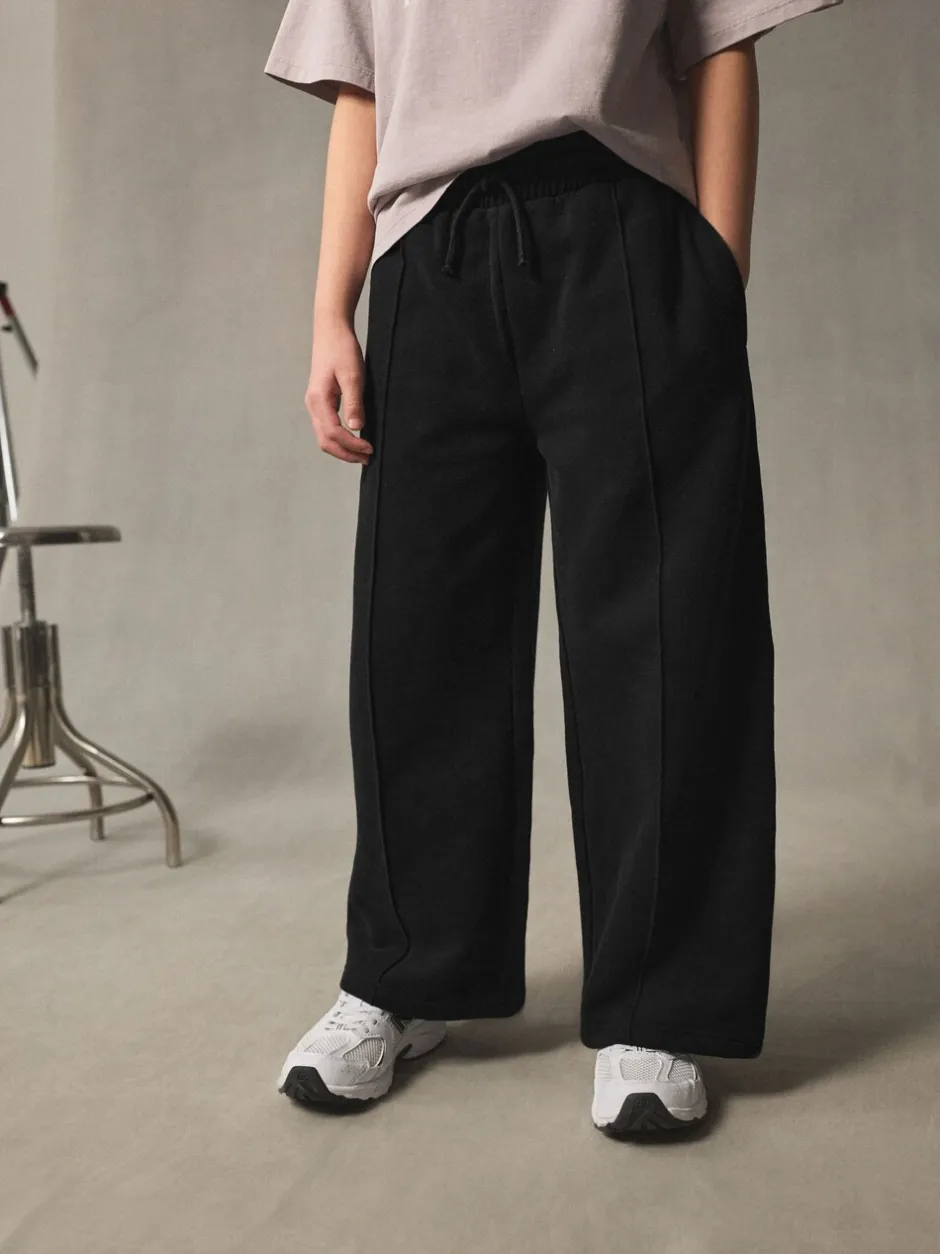Broeken En Leggings*Next - Joggingbroek met wijde pijpen (3-16jr) Zwart