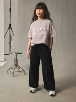 Broeken En Leggings*Next - Joggingbroek met wijde pijpen (3-16jr) Zwart