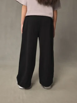 Broeken En Leggings*Next - Joggingbroek met wijde pijpen (3-16jr) Zwart