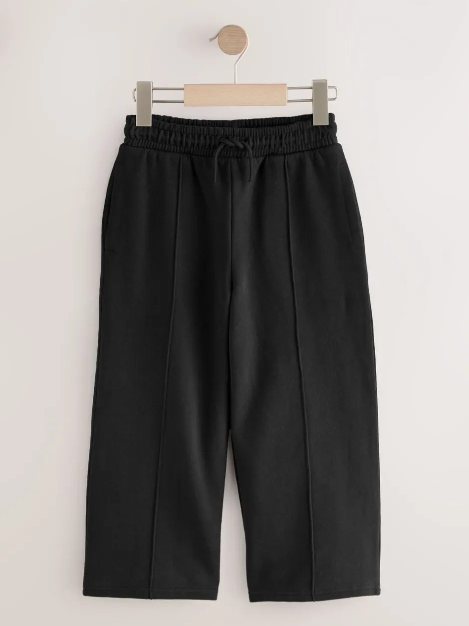 Broeken En Leggings*Next - Joggingbroek met wijde pijpen (3-16jr) Zwart