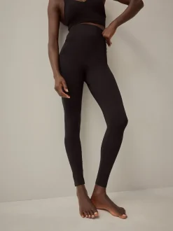 Sportkleding|Leggings En Joggingbroeken|Next Zwart - Naadloze vormgevende legging met buikcorrectie